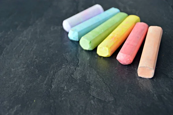 Different Colored Chalks Lie Dark Marble Surface Concept Background Colorful — Stock Photo, Image