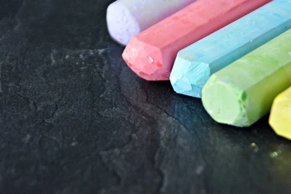 Different Colored Chalks Lie Dark Marble Surface Concept Background Colorful — Stock Photo, Image