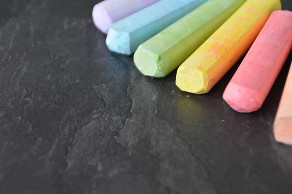 Different Colored Chalks Lie Dark Marble Surface Concept Background Colorful — Stock Photo, Image