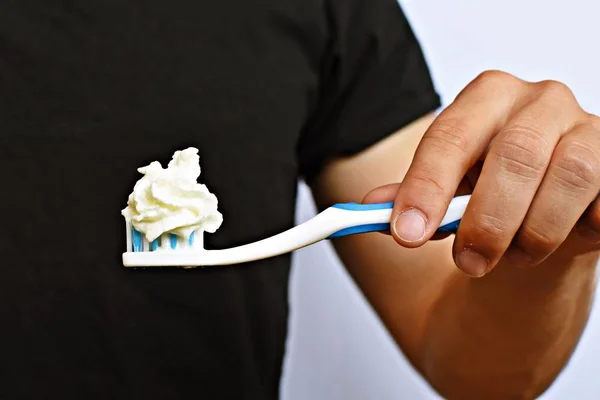 Man Holds Toothbrush Front His Torso Instead Toothpaste Cream Brushes — Stock Photo, Image