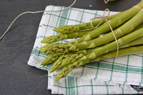 Many bars of green asparagus are uncooked