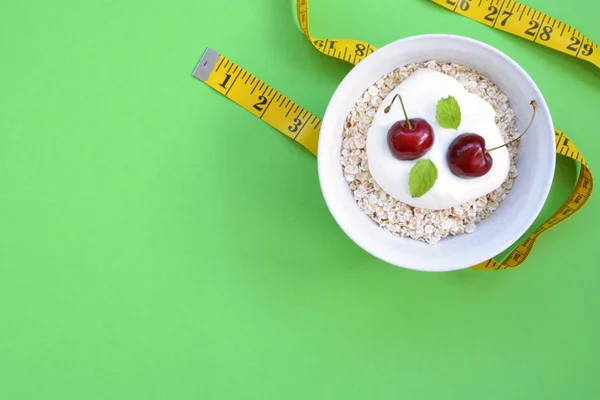 White Bowl Full Oatmeal Dollop Yoghurt Cherries Fruit Next Lying — Stock Photo, Image