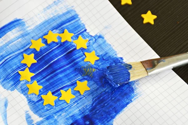 Brush Blue Paint Well Punched Out Yellow Paper Stars Flag — Stock Photo, Image