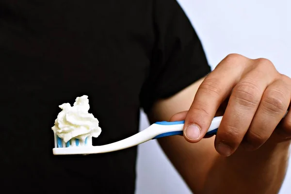 Man Holds Toothbrush Front His Torso Instead Toothpaste Cream Brushes — Stock Photo, Image