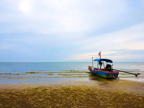 Thailand sea with boat.Fishing boat on beach with sea and sky background