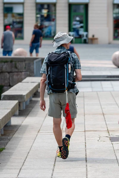 Man Goes Street Backpack Wear Swimming Trunks Attached Backpack View — Stock Photo, Image