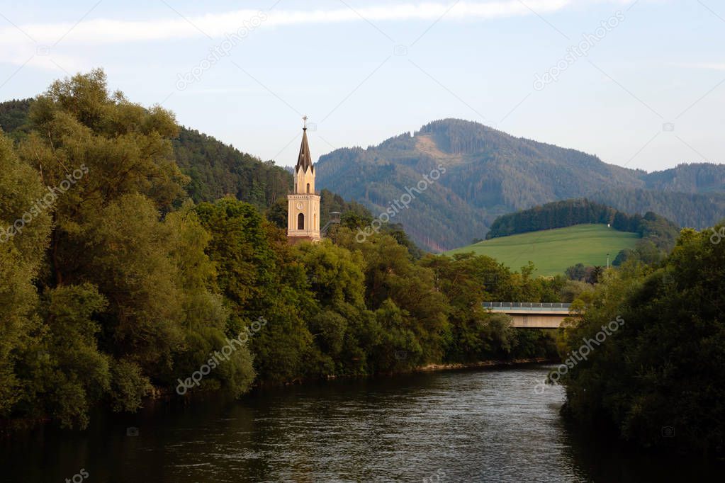 View of Mur river with church in Leoben,Austria