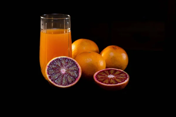 Glass Juice Knife Cut Red Oranges Black Background — Stock Photo, Image