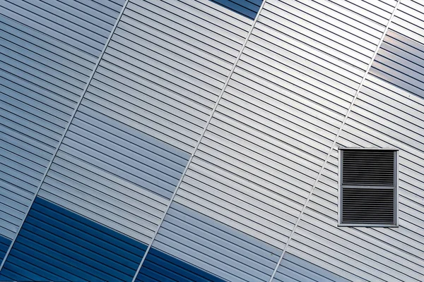 Abstract architectural background from modern buildings facade with blue and silver lines - image — Stock Photo, Image