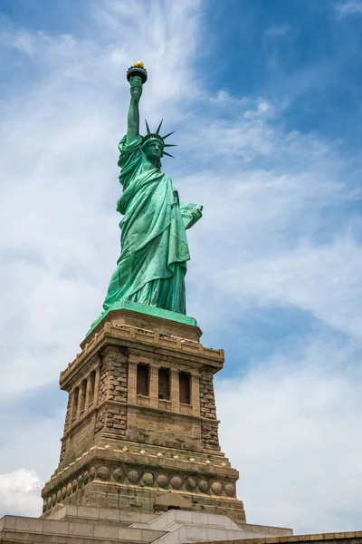 Statue of Liberty on Liberty Island closeup with blue sky in New York City Manhattan - Image