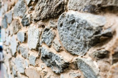 Eski, farklı renklertaş duvar arka plan doku yakın. Seçici odaklama.