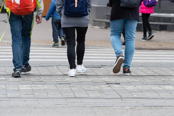 Feet of pedestrians walking on the crosswalk - image — Stock Photo, Image