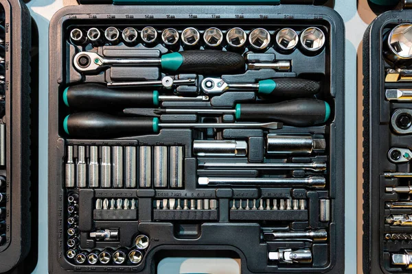 Box with special tools in car repair shop, closeup - image