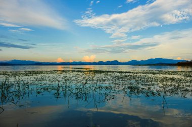 View of river and mountain on blue sky background