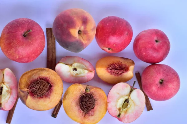 peaches and apples on a white background