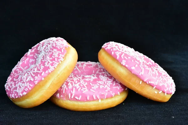 doughnuts with pink glaze close up