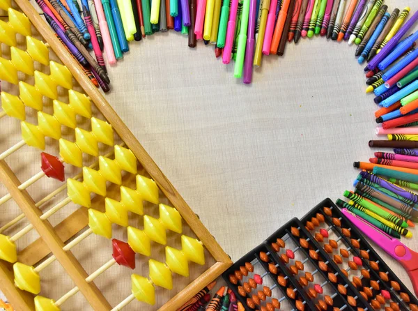 abacus and pencils on the table