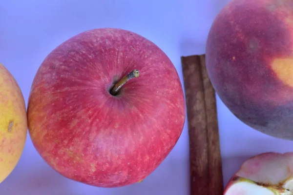 peaches and apples on a white background