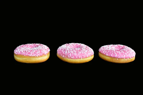 doughnuts with pink glaze close up