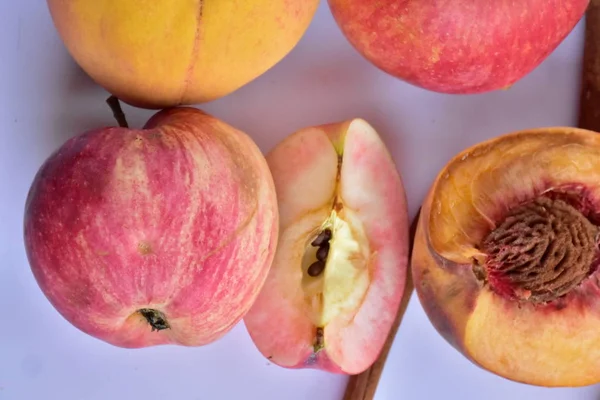 peaches and apples on a white background