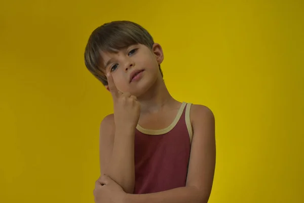 portrait of a child against yellow background