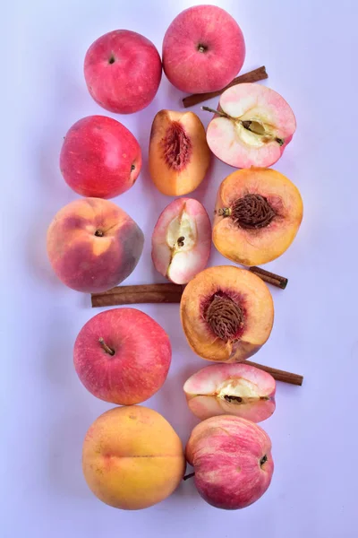 peaches and apples on a white background