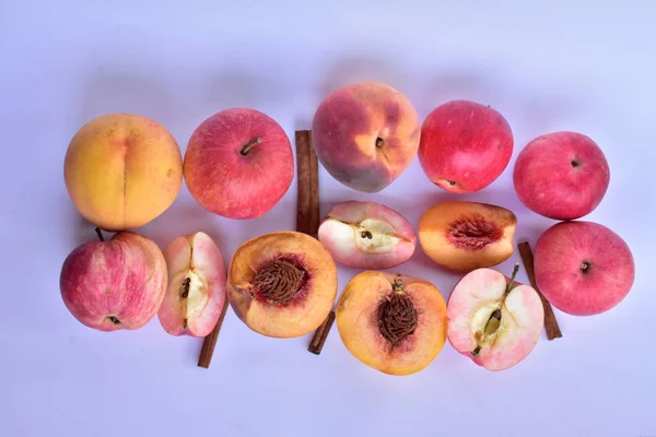 peaches and apples on a white background