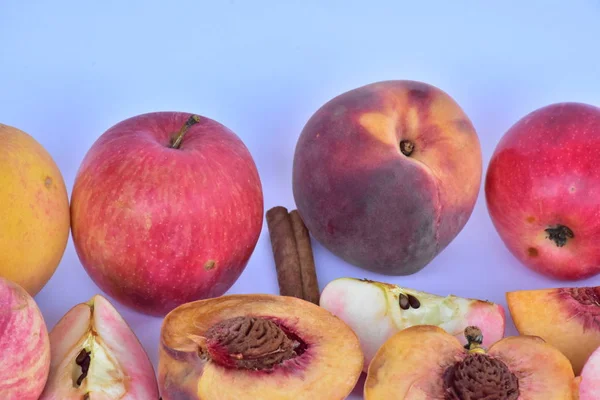 peaches and apples on a white background