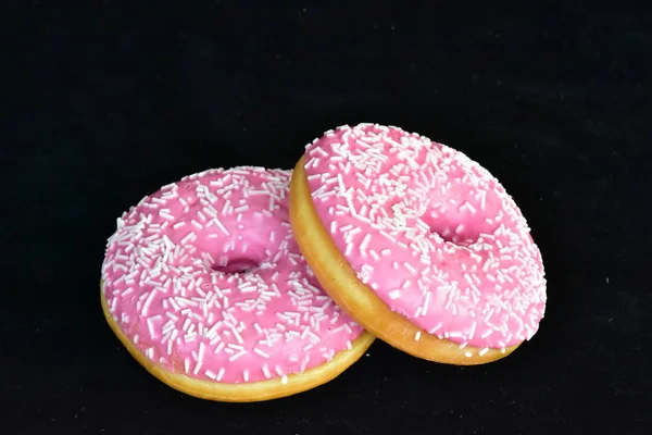 doughnuts with pink glaze close up