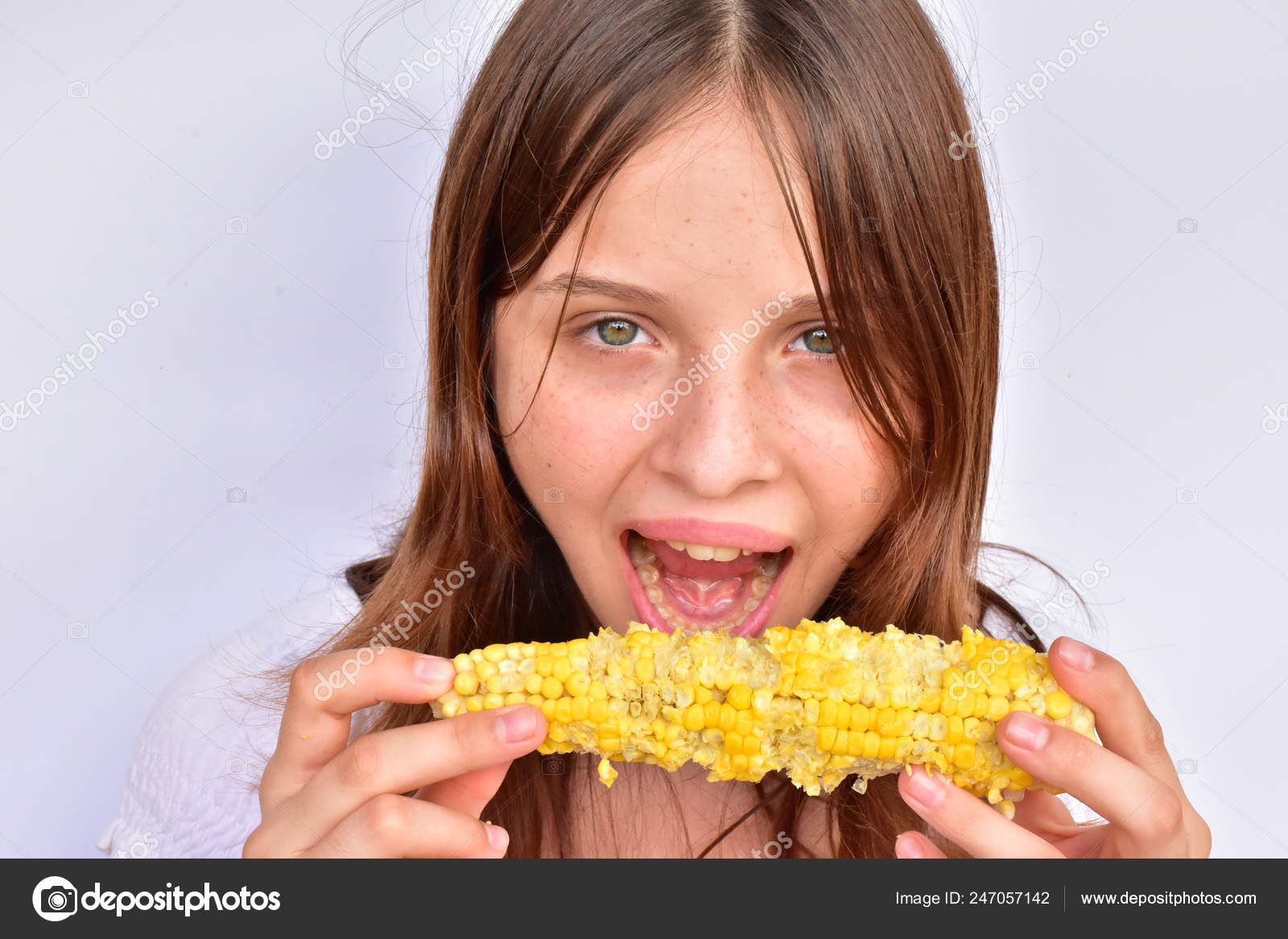 Girl Eating Corn Close Stock Photo by ©GalinkaLB 247057142