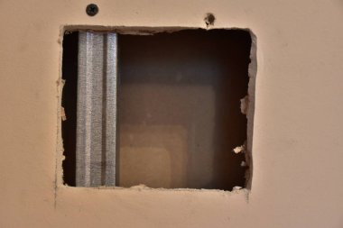 the wall and broke hole for electricity 