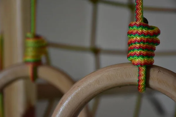 wooden gym rings on ropes, sport concept