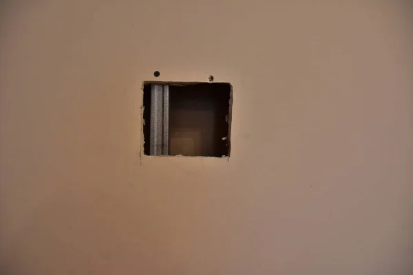 the wall and broke hole for electricity