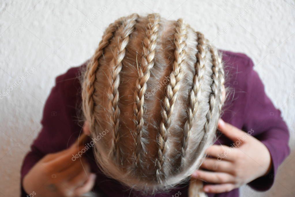 plaited pigtails on the head, blonde,
