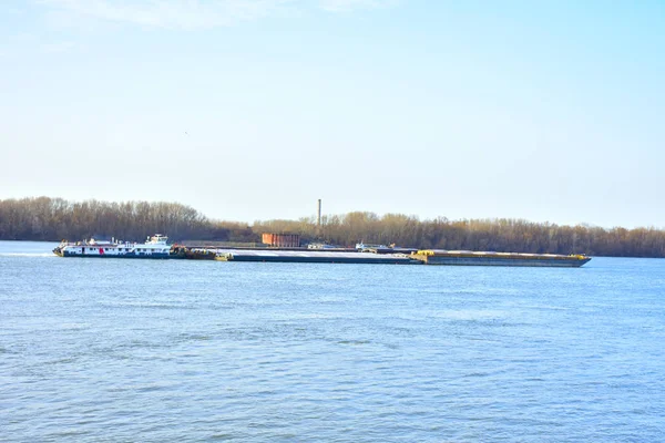 Giant barge moored in river during daytime