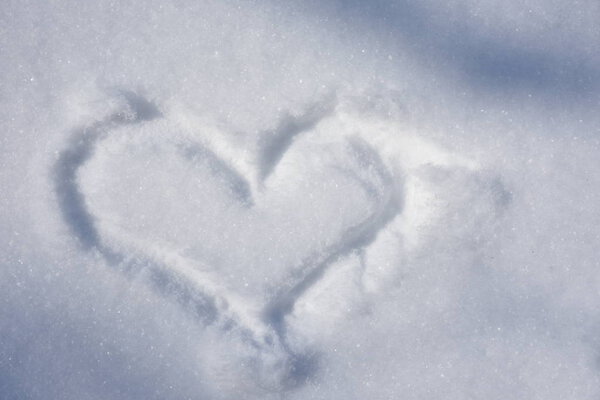 snow covered land and heart sign shape 