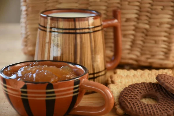 big wooden cup of milk and cookies