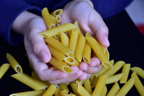 pasta in hand  close up