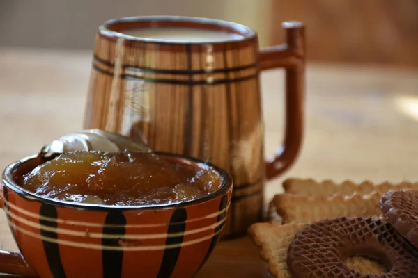 big wooden cup of milk and cookies