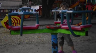 Little happy boy having fun on playground