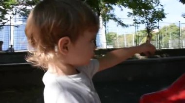 Handsome little boy having fun on playground 