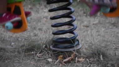 Little kids playing beautiful playground in the park