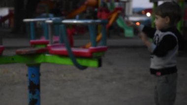 Little happy boy having fun on playground