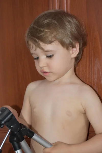 Portrait Cute Boy Examining Tripod Camera — Stockfoto