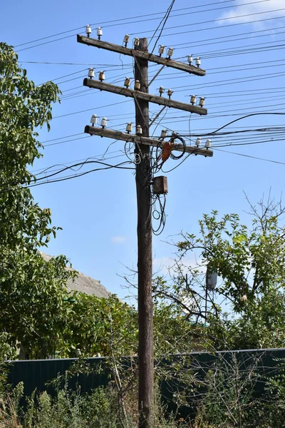 transmission lines, electric tower against blues sky