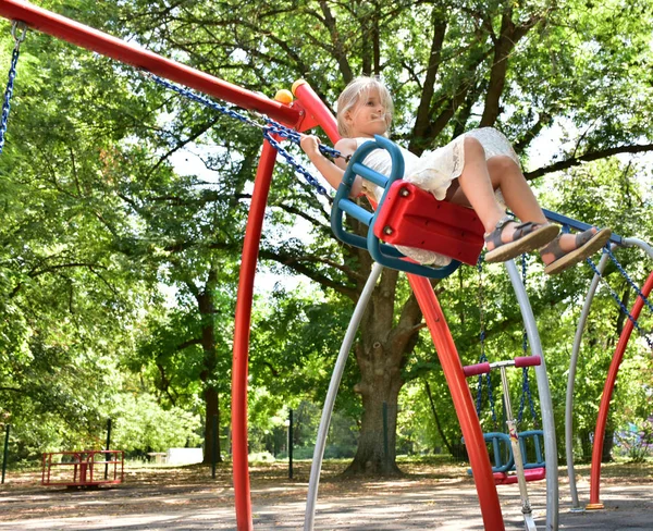 Little Blonde Girl Riding Swing — Stock Photo, Image