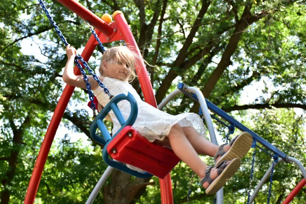 Little Blonde Girl Riding Swing — Stock Photo, Image