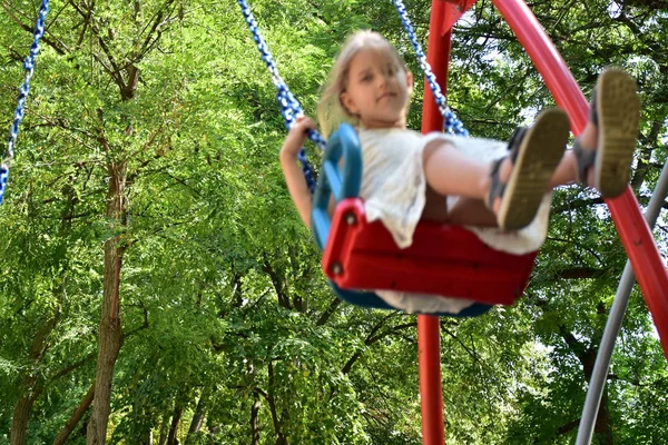 Little Blonde Girl Riding Swing — Stock Photo, Image