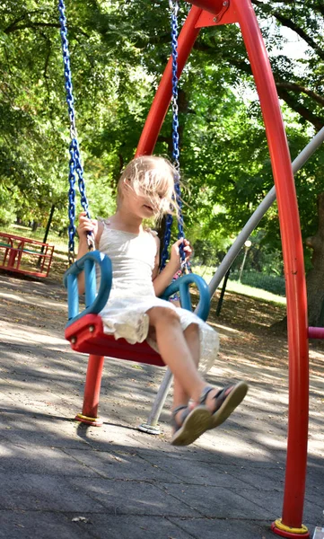 Little Blonde Girl Riding Swing — Stock Photo, Image