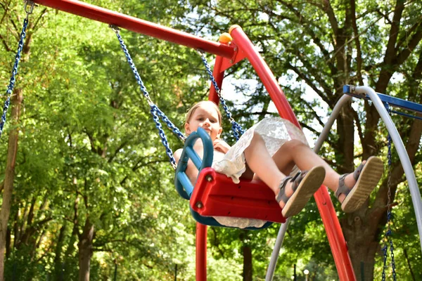 Little Blonde Girl Riding Swing — Stock Photo, Image